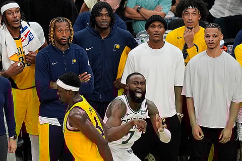 Jaylen Brown (7) reacts after he makes a 3-point shot